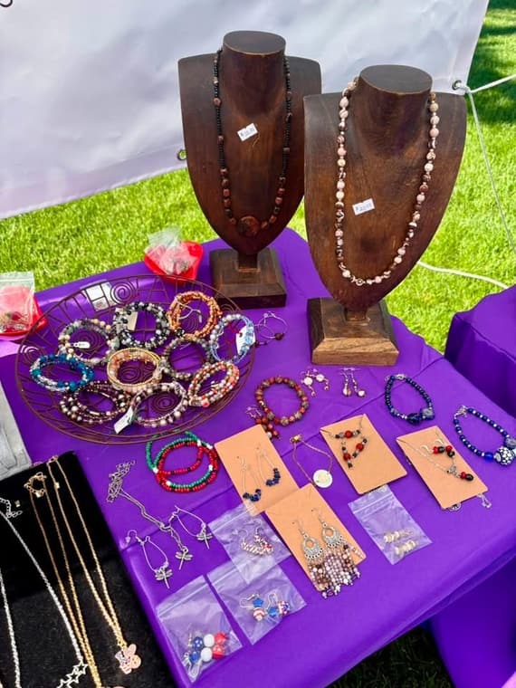 Long beaded necklaces on wooden display busts